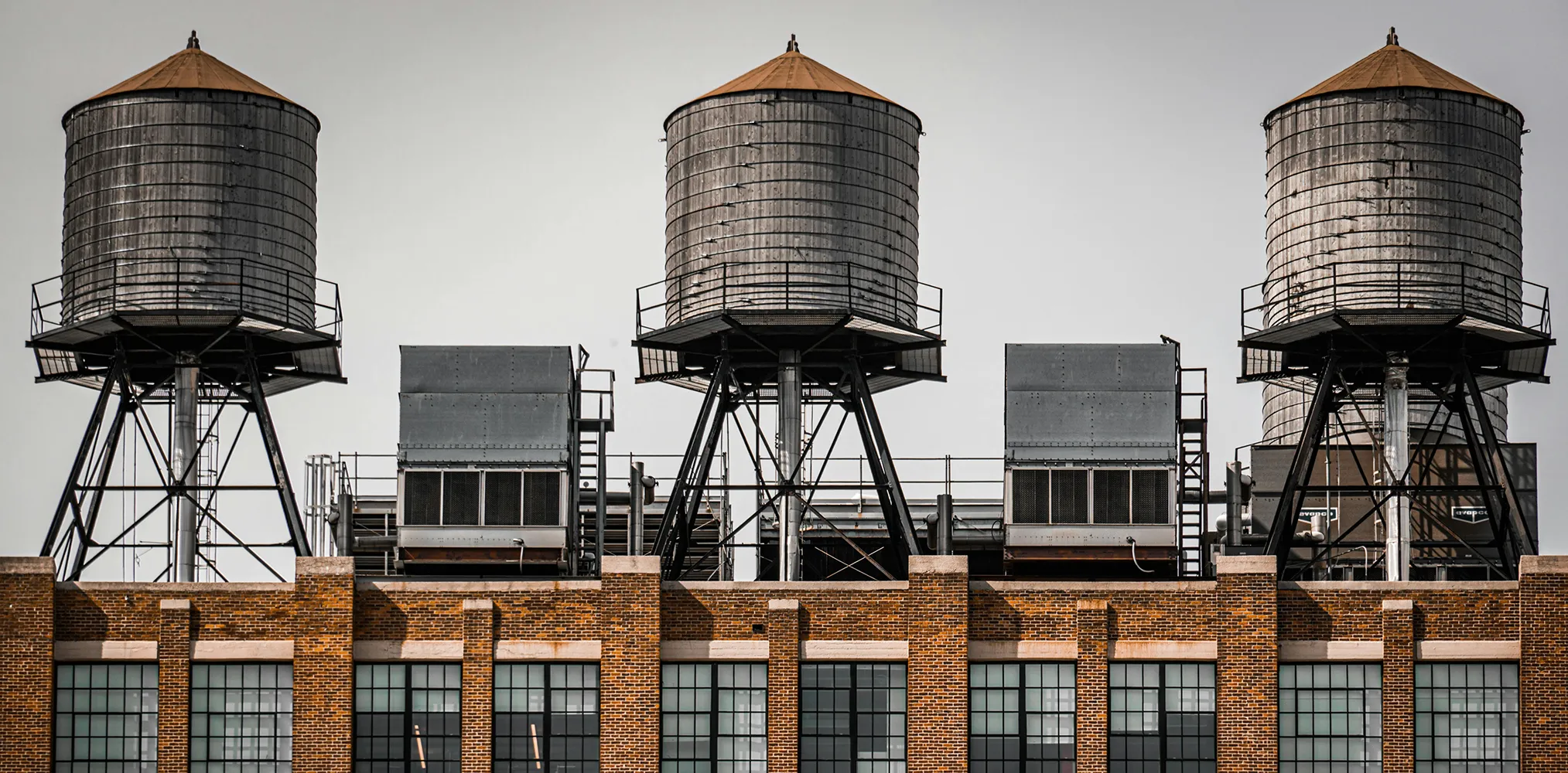 Two rooftop cooling tower units on a commercial building for HVAC